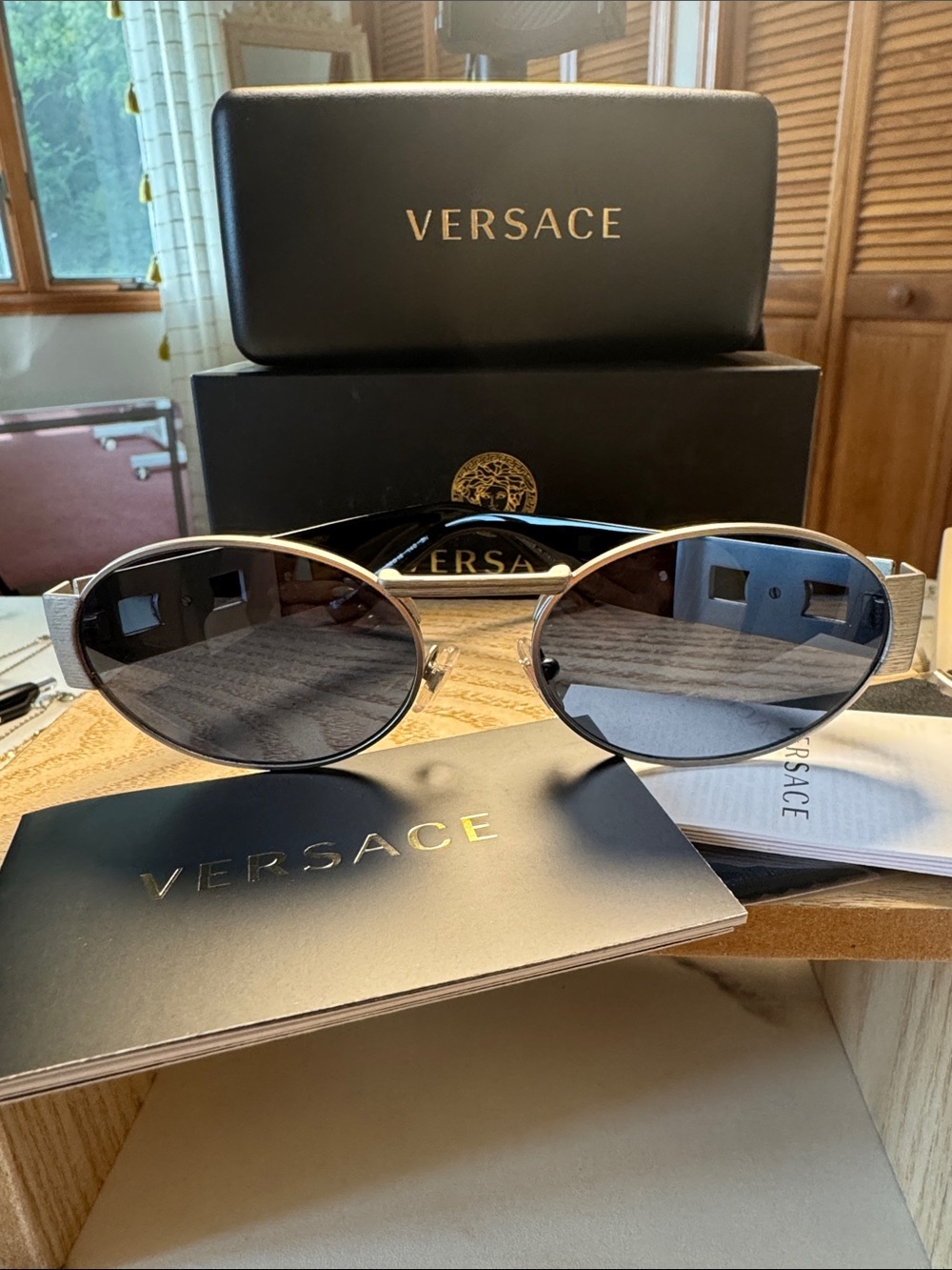 Versace Women's Oval Metal Frame Sunglasses in Black and Silver